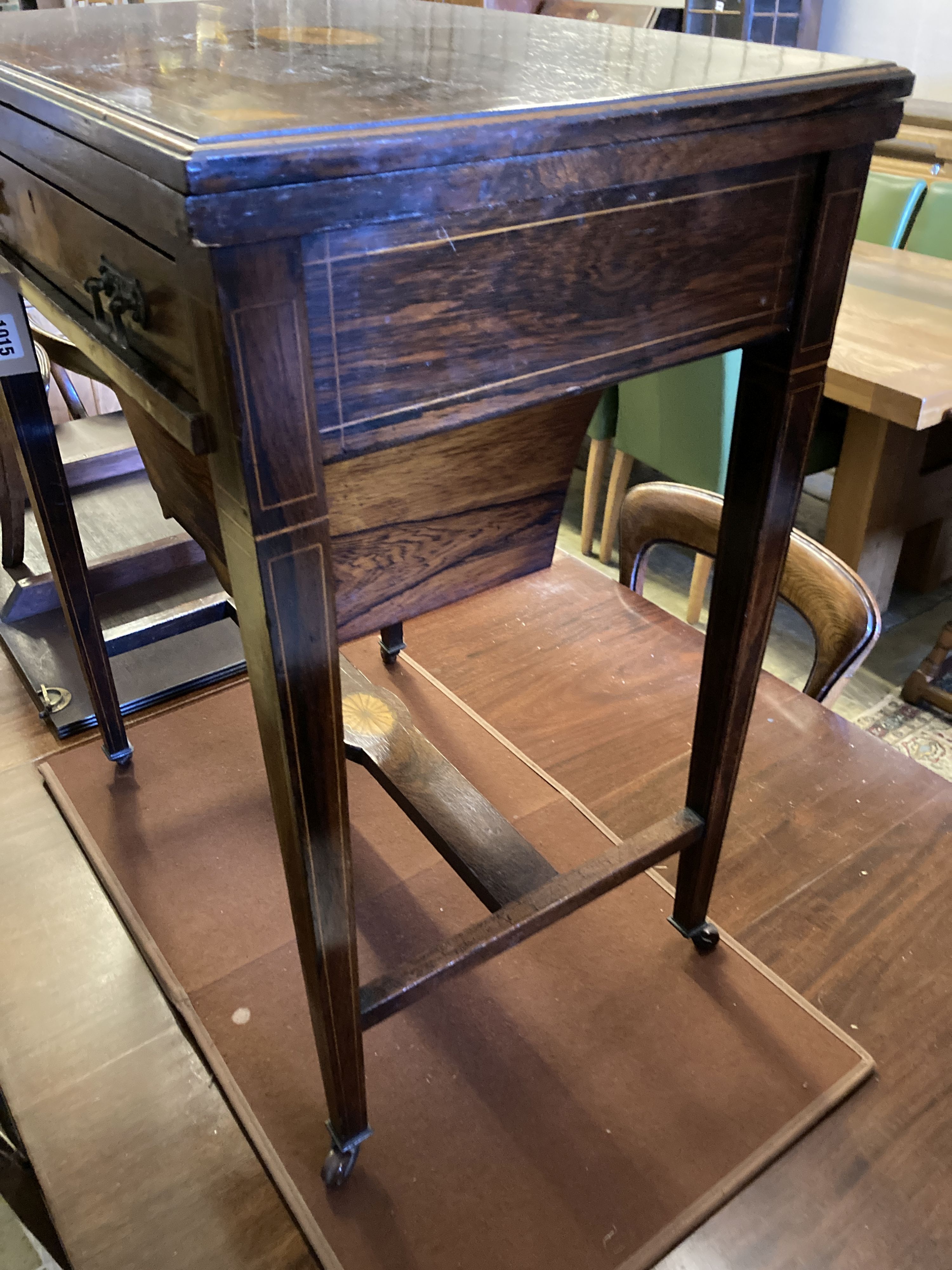 A late Victorian inlaid rosewood games table, width 55cm, depth 40cm, height 71cm